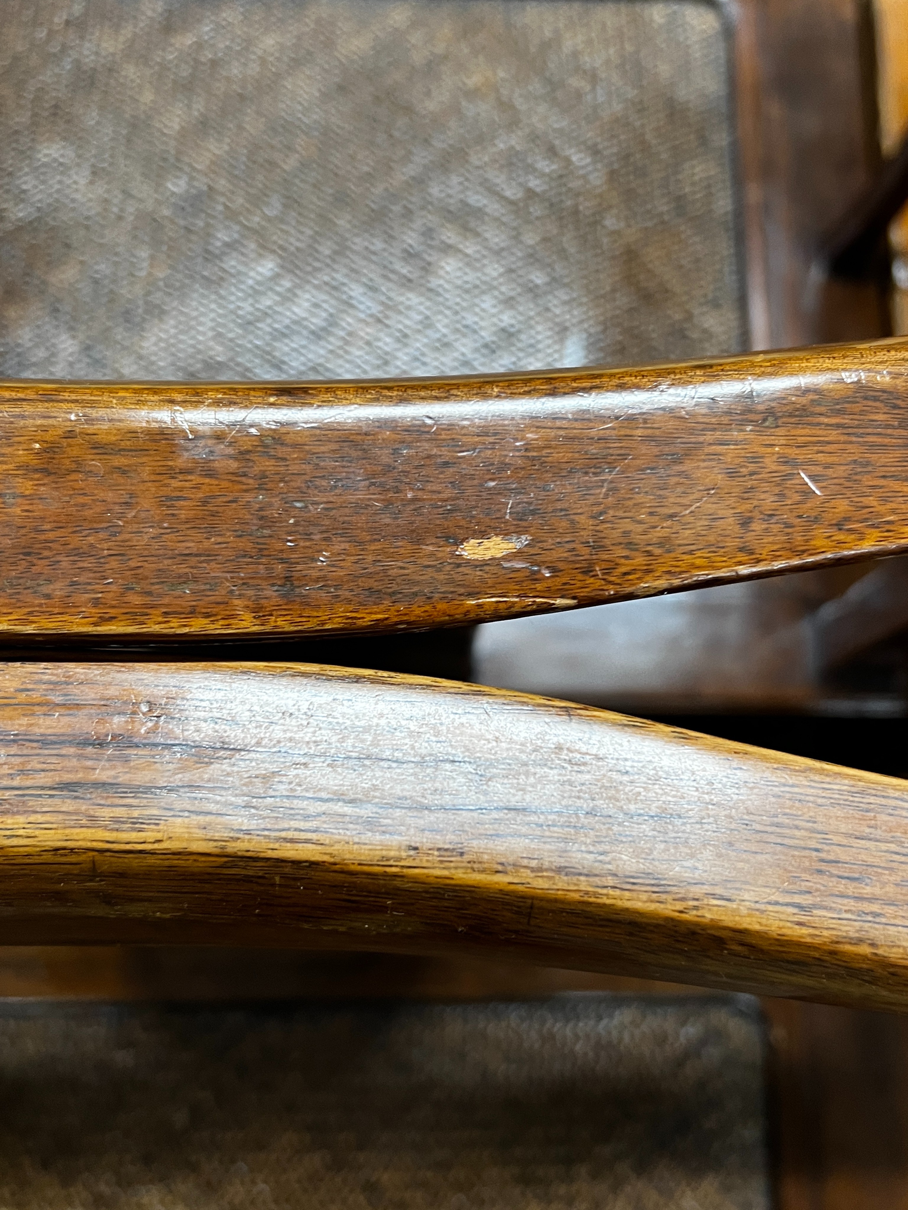 A pair of Chinese caned hardwood elbow chairs, width 55cm, depth 44cm, height 97cm